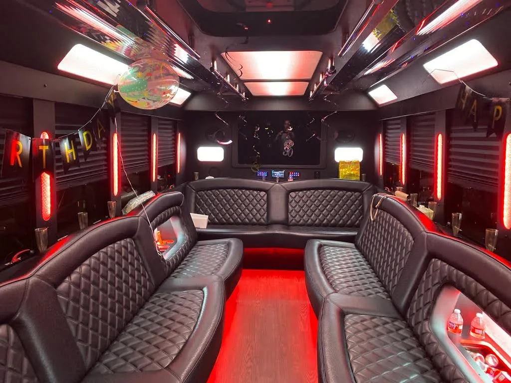 Stretch limousine interior — leather seating, champagne, intimate setting for 6-14 guests