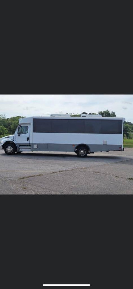 30-passenger prom party bus exterior at venue