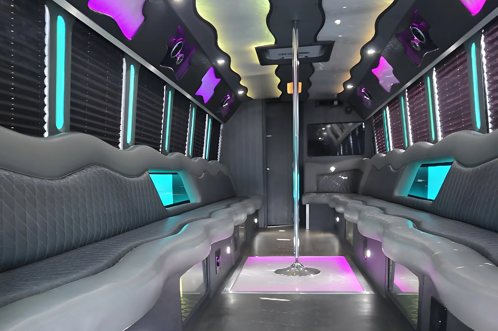 34-Passenger Party Bus interior with LED dance floor and dance pole - Royal Carriage Limousine Chicago