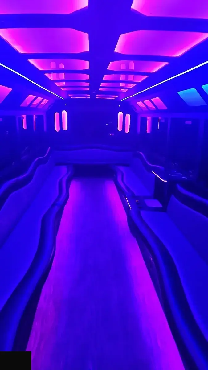 Party bus clean leather interior with ambient lighting for wedding guests